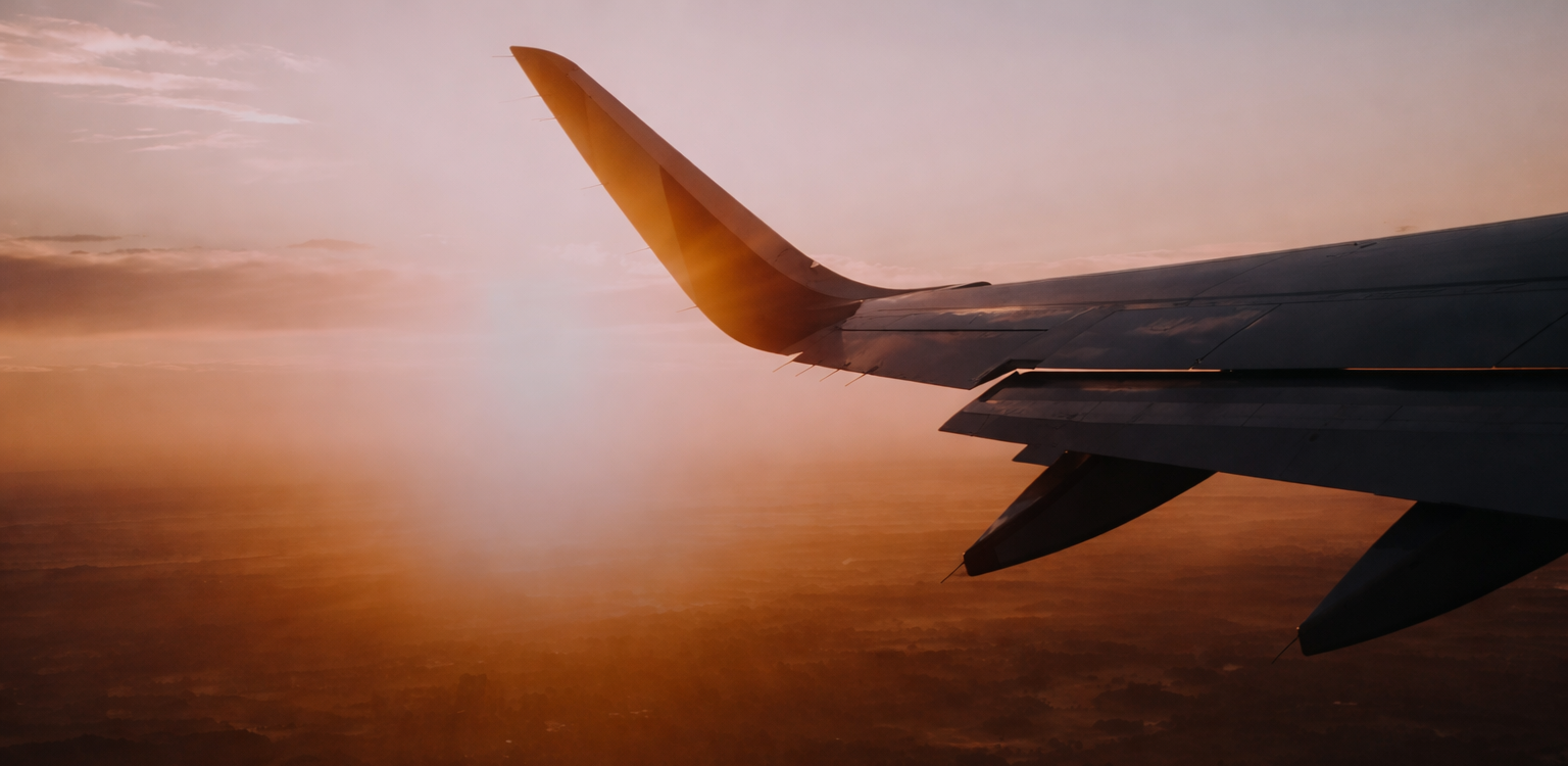 Aircraft wing at sunset